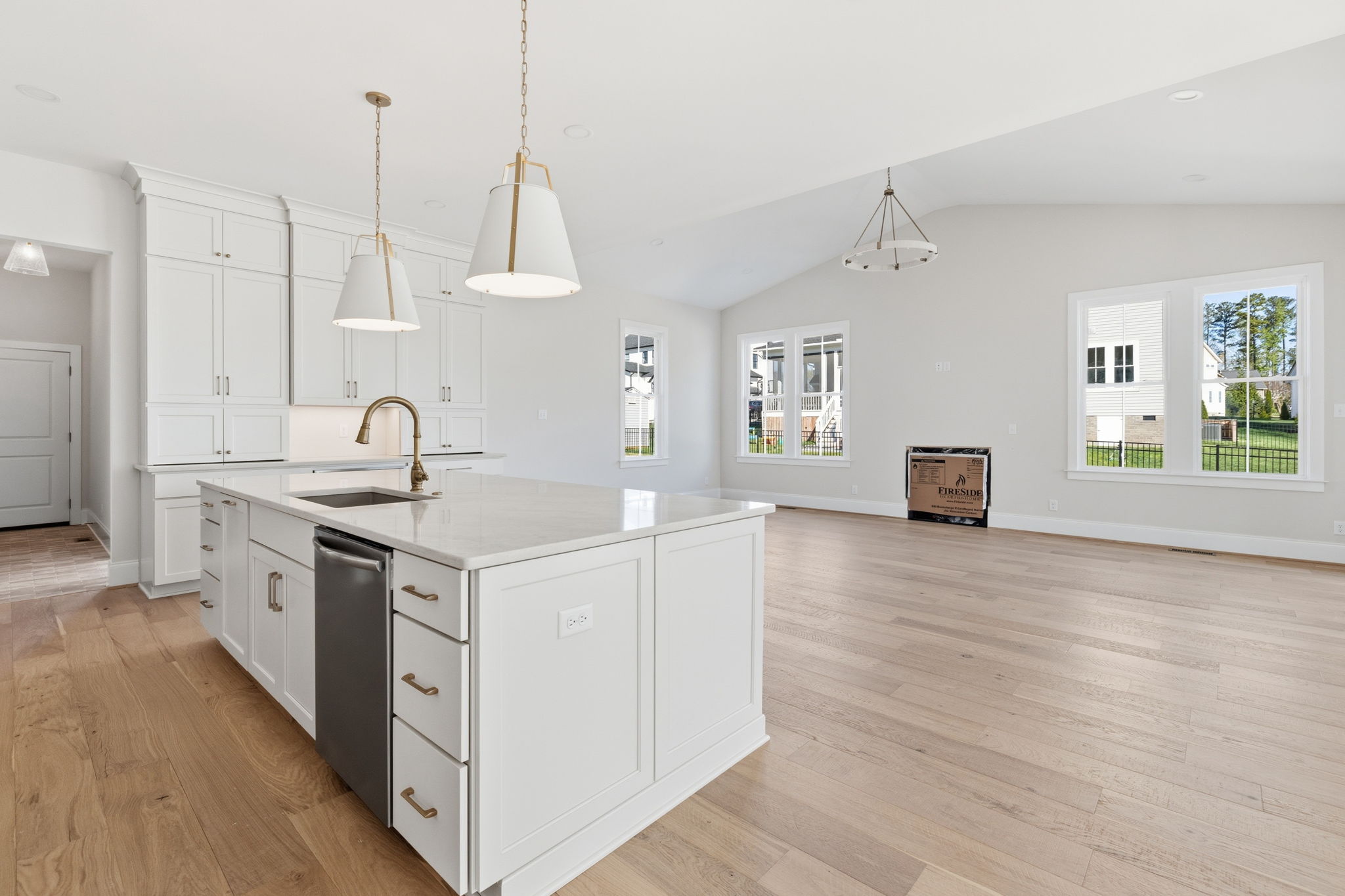 spacious entertainment area with island and high ceilings