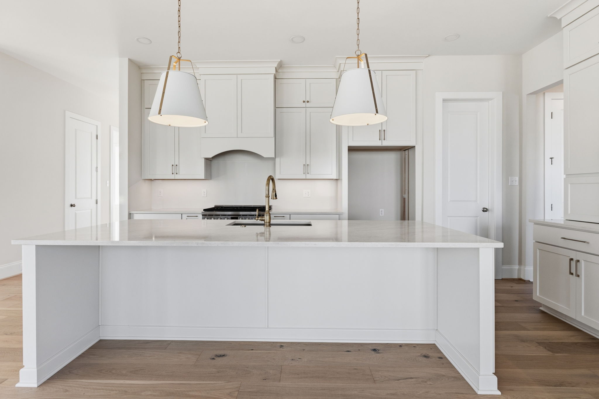 front view of kitchen with island and cabinets