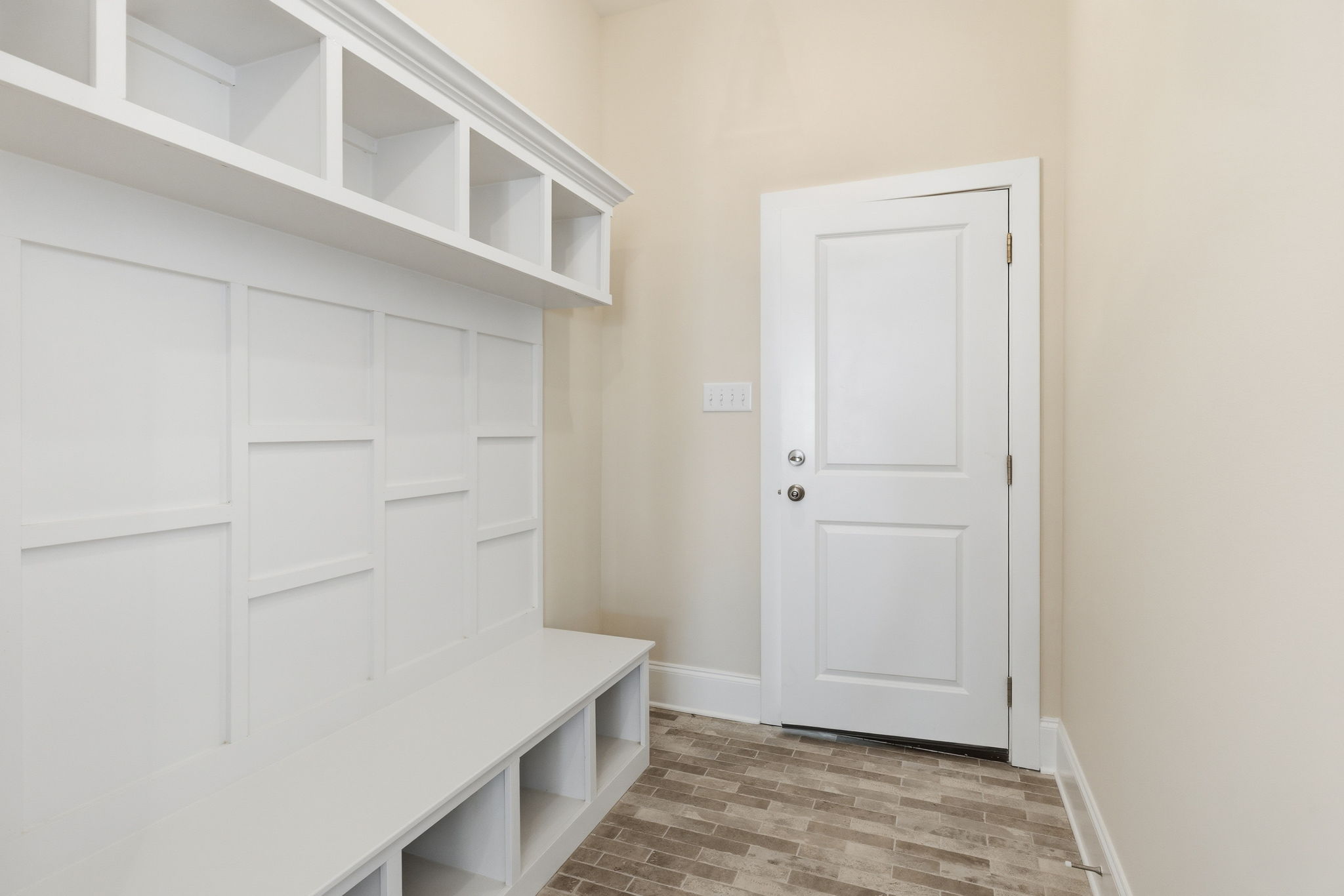 mudroom entrway with shelving